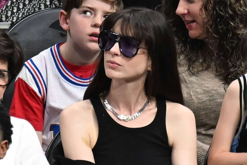 Anne Hathaway Attended an NBA Game in the Comfy Basic That Has Us Ditching White Tank Tops This Spring